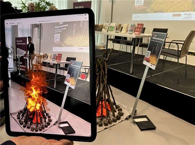 Die Technik Augmented Reality wird unterstützt durch ein „Erklärmännchen“.