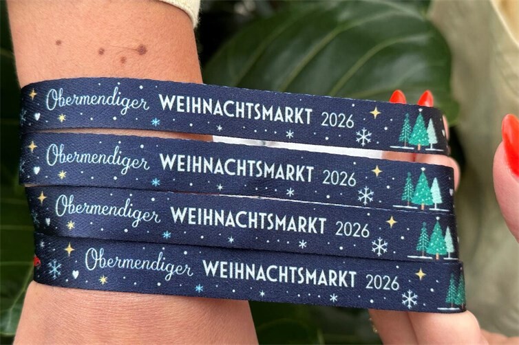 Eine schöne Erinnerung und die Gewissheit den Obermendiger Weihnachtsmarkt unterstützt zu haben: das Bändchen zum Markt