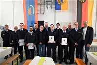 Gruppenbild mit den ernannten und geehrten Personen. 