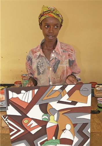 Mitglied einer Genossenschaft von Kunsthandwerkerinnen in Ruanda als Begünstigte eines Kleinkreditprojektes. privat