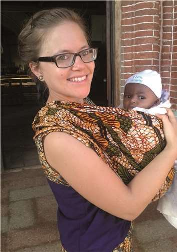 Nina Brandenburger mit dem kleinen Augustino, unmittelbar nach dessen Taufe.privat