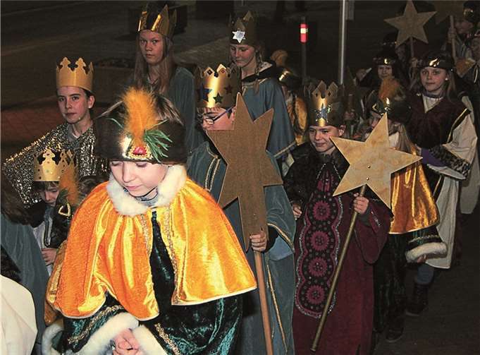 Unterstützung von Kindern für die Not leidenden Kinder in aller Welt durch die Sternsingeraktion.