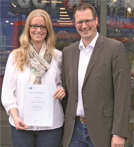 Wiebke Neitzert und Oliver Krumholz, Geschäftsführer von Intersport Krumholz.  Privat