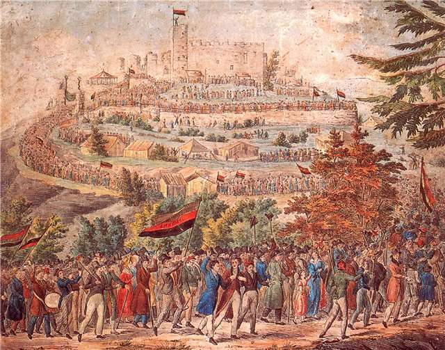 Zug von Pfälzer Bürgern mit gold-rot-schwarzen Fahnen zur Maifeier 1832 auf der Kästenburg („Hambacher Schloss“) nahe dem heutigen Neustadt an der Weinstraße. Zeitungsbeilage, 1832. Foto: Alexander Thon M.A., Lahnstein