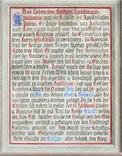 Zum Bildprogramm gehörendes Schriftfeld über das Leben des Heiligen.